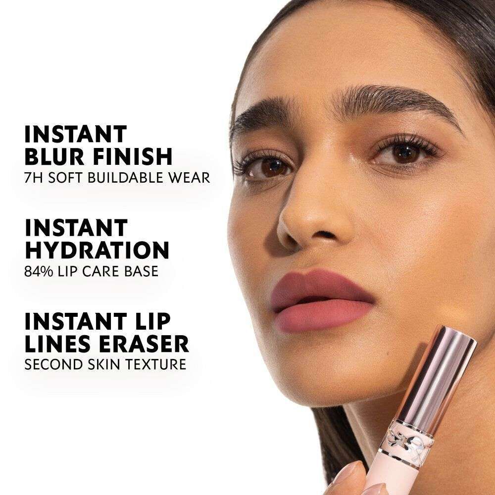 Model wearing YSL LOVENUDE LIP BLUSHER with soft blurred matte nude lip finish.