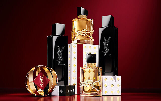 LIBRE and MYSLF fragrance bottles arranged together on luxury Holiday gift packaging.