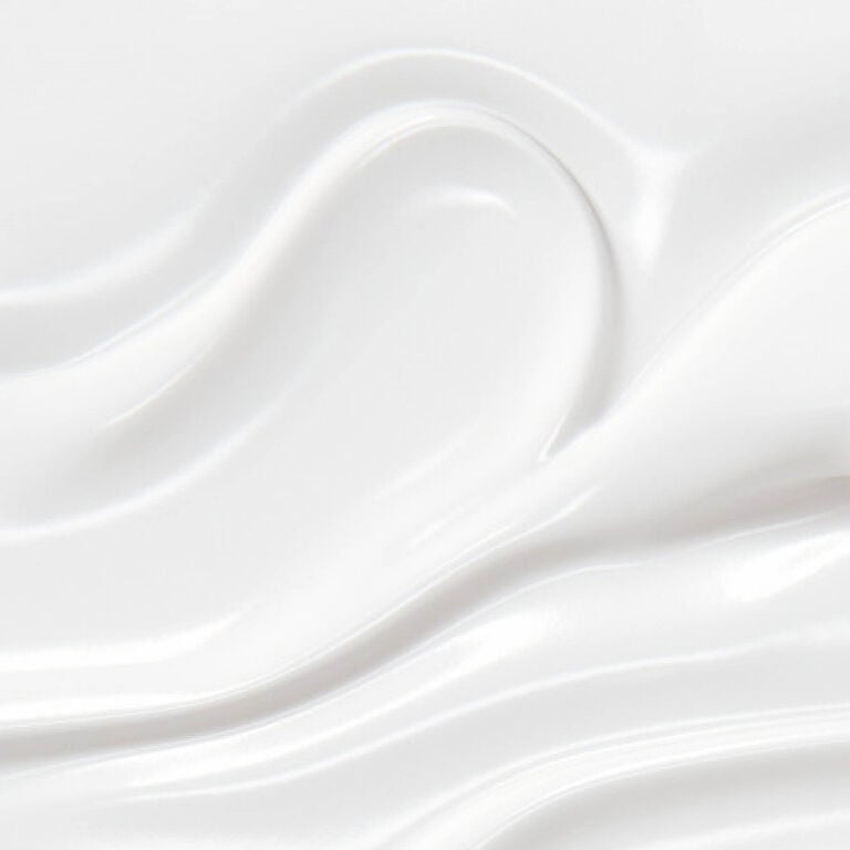 YSL Pure Shots Eye Reboot Cream, a close-up of its smooth, luxurious white texture, emphasizing its richness.