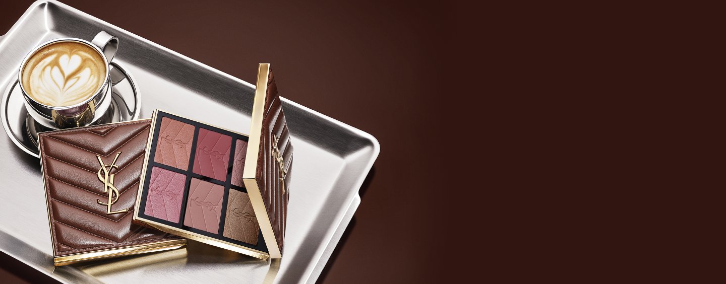 YSL Fall Drop latte makeup collection with Loveshine Lip Oil, Face Palette and Make Me Blush and a cup of coffee on a silver tray