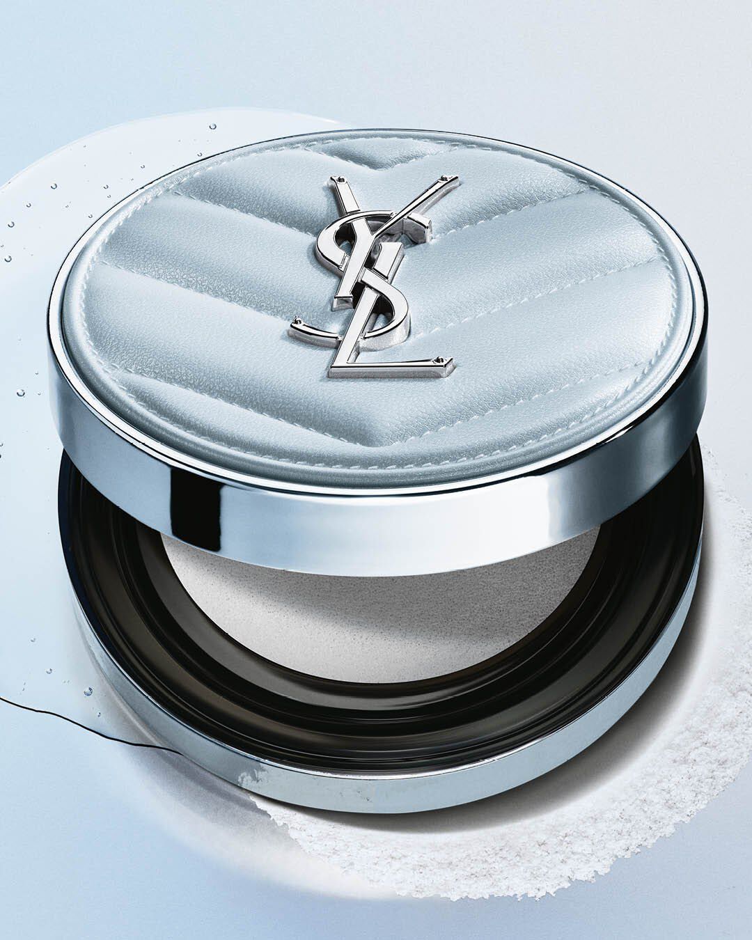 YSL All Hours Blur Cushion, light blue quilted compact, with liquid and powder elements, highlighting its texture.