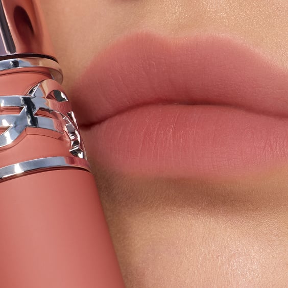 Macro close-up of soft-blurred, nude pink
lips.